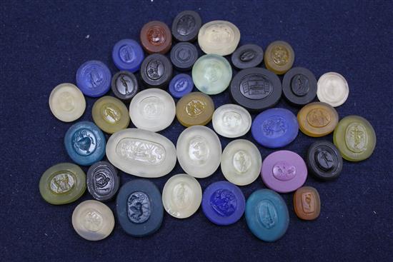 A collection of thirty seven various unmounted hardstone and glass Grand Tour intaglios, largest 1.5in.